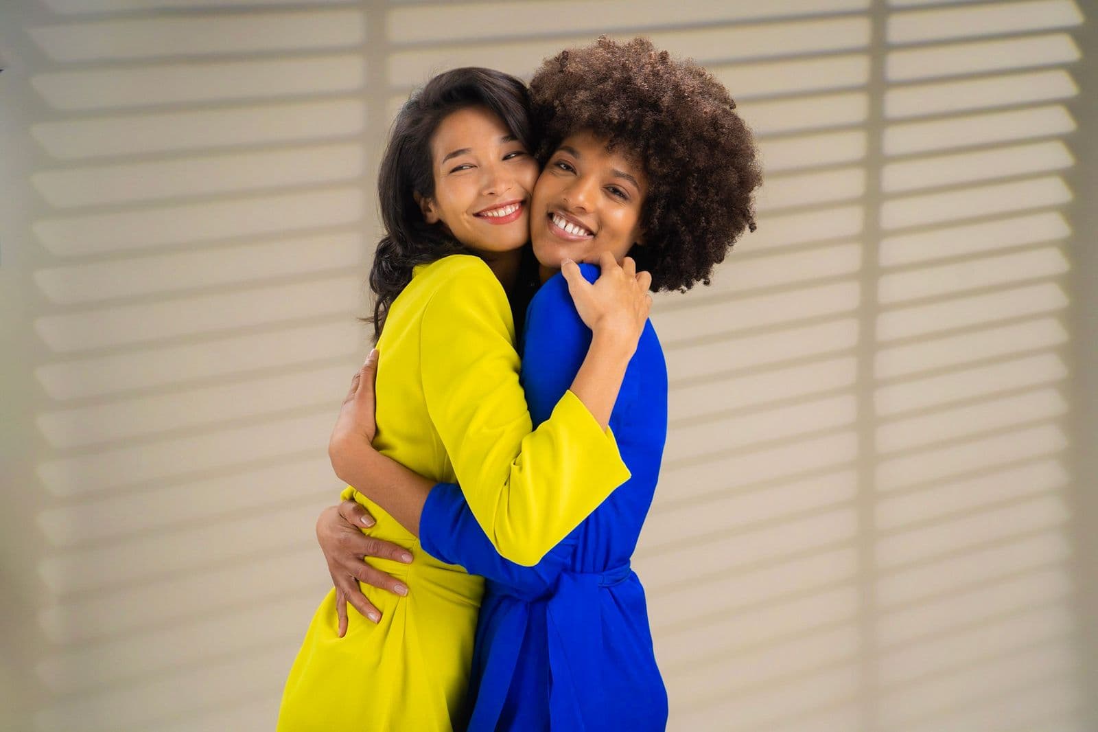 Two women radiating confidence and joy